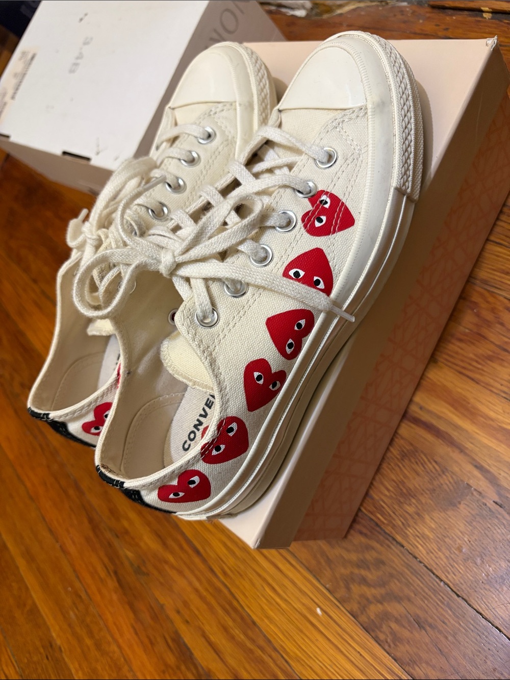 Converse women’s comme des garçons Cream Low-Top Sneakers with Red Heart Motif